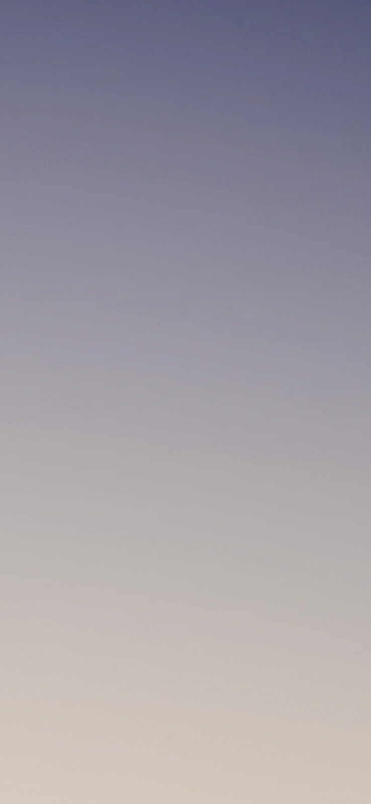 A smooth dusk gradient from blue to a warm horizon, developed on PRO 400H: cool, airy and fine grained.